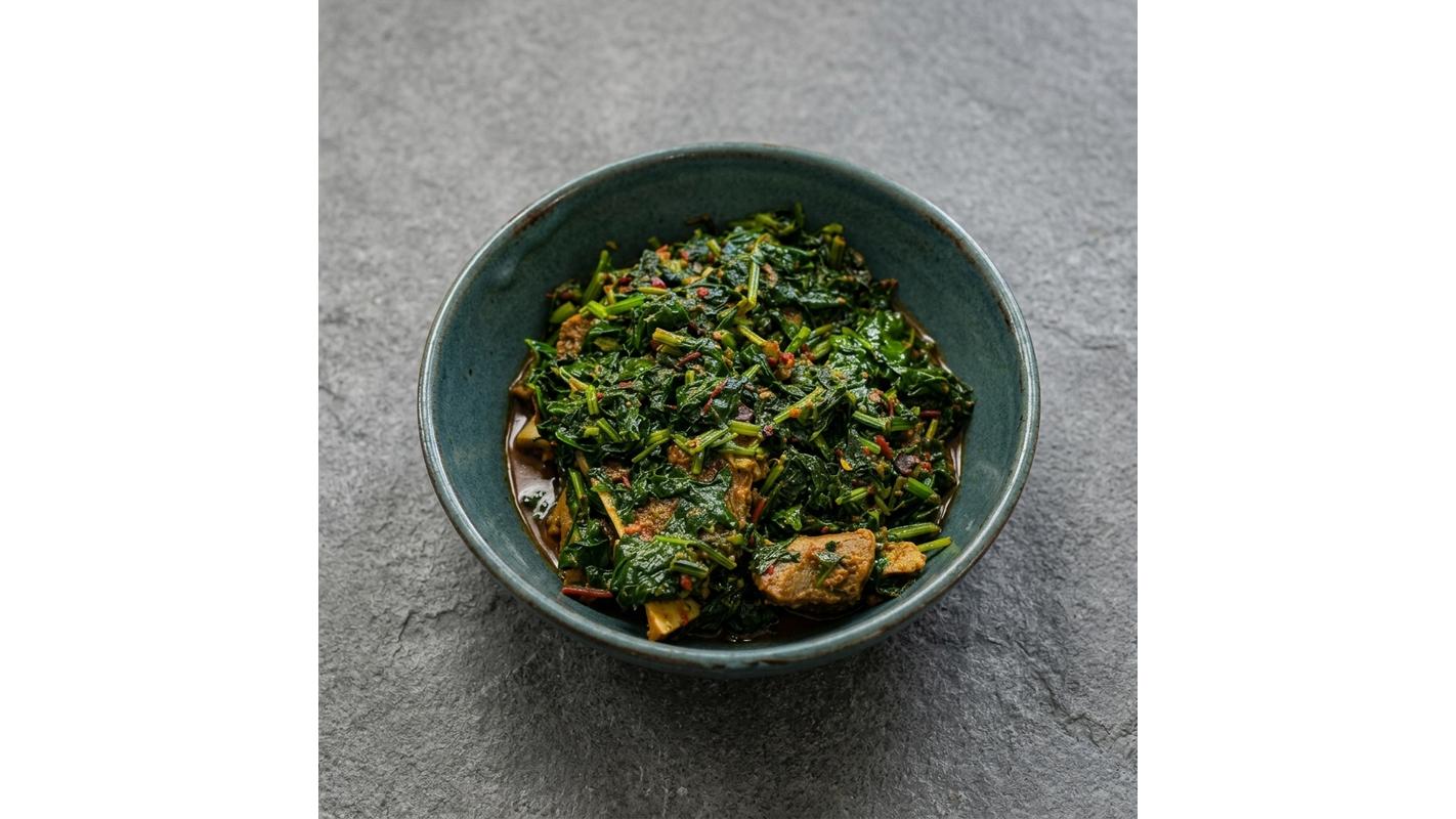 A Small Bowl Of Eforiro Soup With 2 Proteins Of Choice