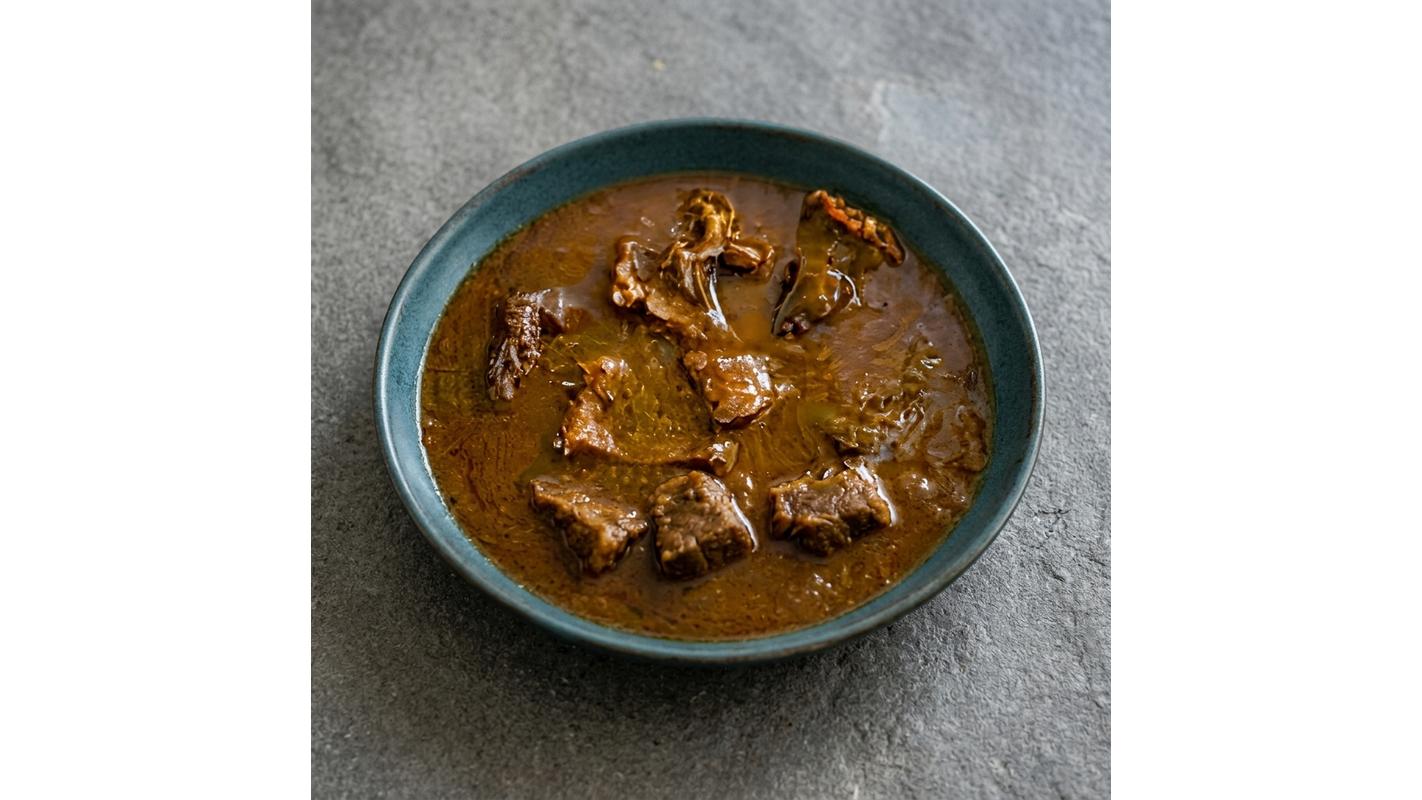 A Small Bowl Of Ogbono Soup With 2 Proteins Of Choice